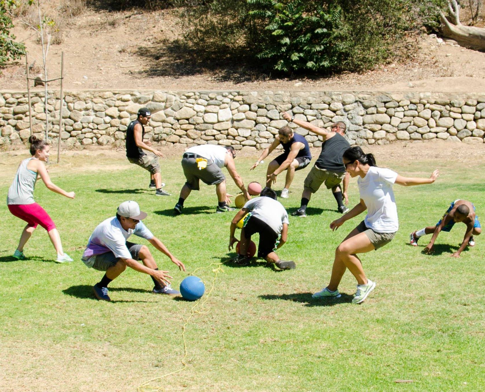 Big Kids of all Ages In Action Playing Dodgeball
