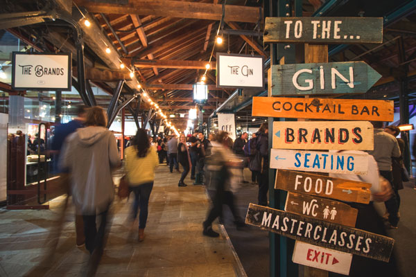 Sign pointing to all the features at Gin Festival