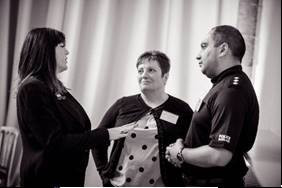 An image of Louise Macdonald, Chair of the NAWG, talking to a woman and man