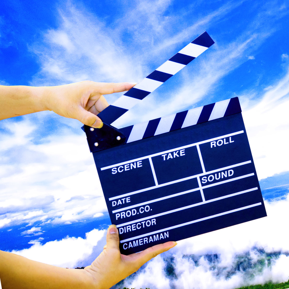 Movie slate in front of a blue sky
