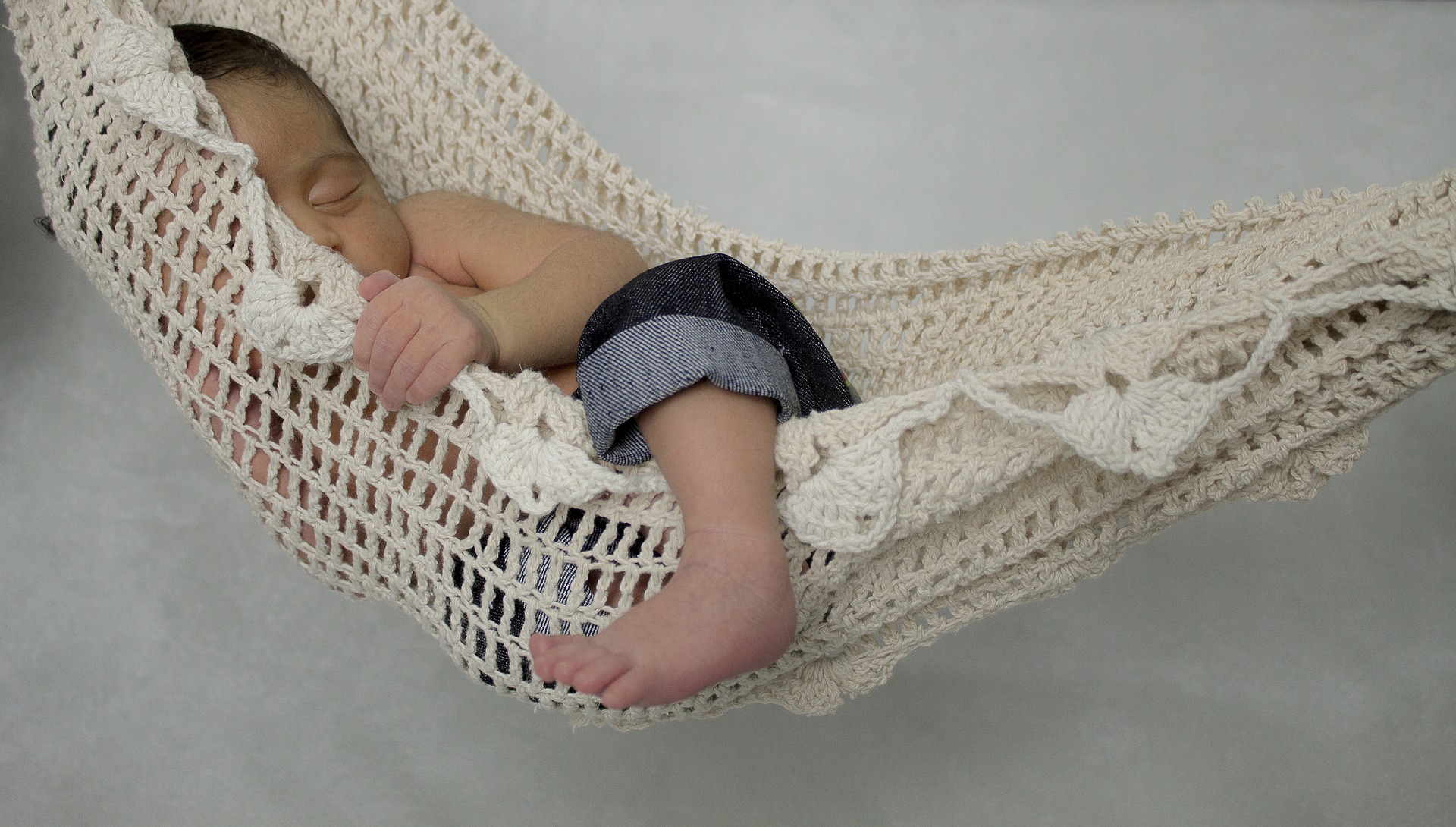 baby asleep in a hammock