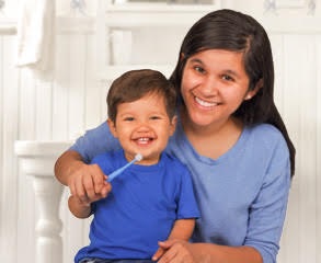 helping child brush