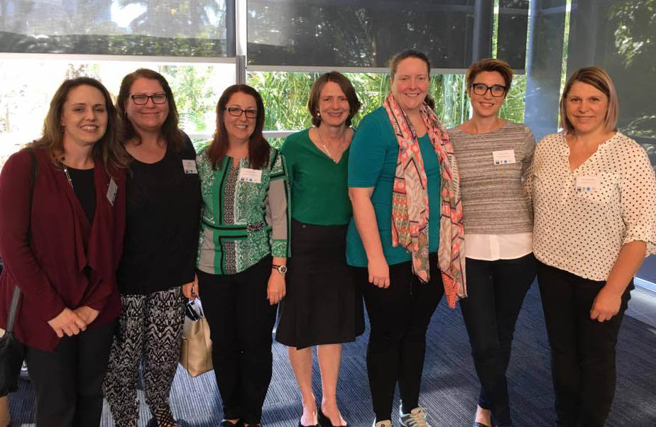 Photo of Lisa Bridle with Members of the QCIE