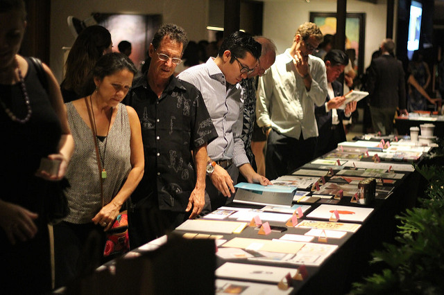 5-O show attendees browse the display of winners in 2015