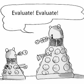 two daleks, the larger dalek speaking 'Evaluate, Evaluate'