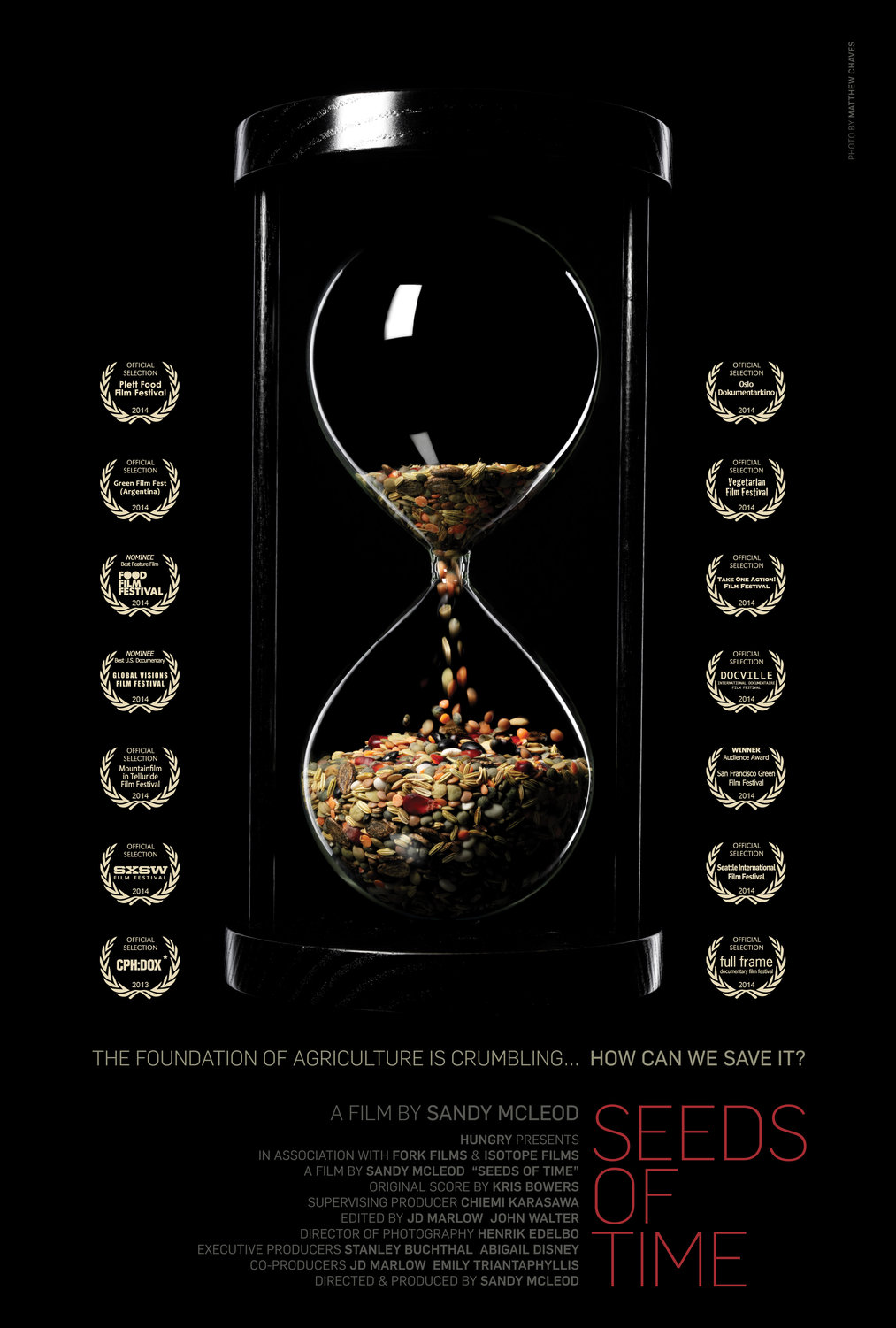 poster for the movie Seeds of Time, with a center image of an hourglass timer filled with grains instead of the expected sand 