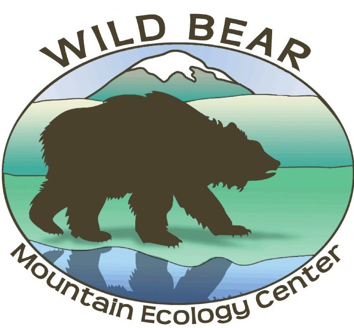 logo for wild bear mountain ecology center, with an illustrated bear walking in profile in front of a mountain backdrop