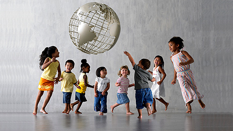 Children dancing around our earth