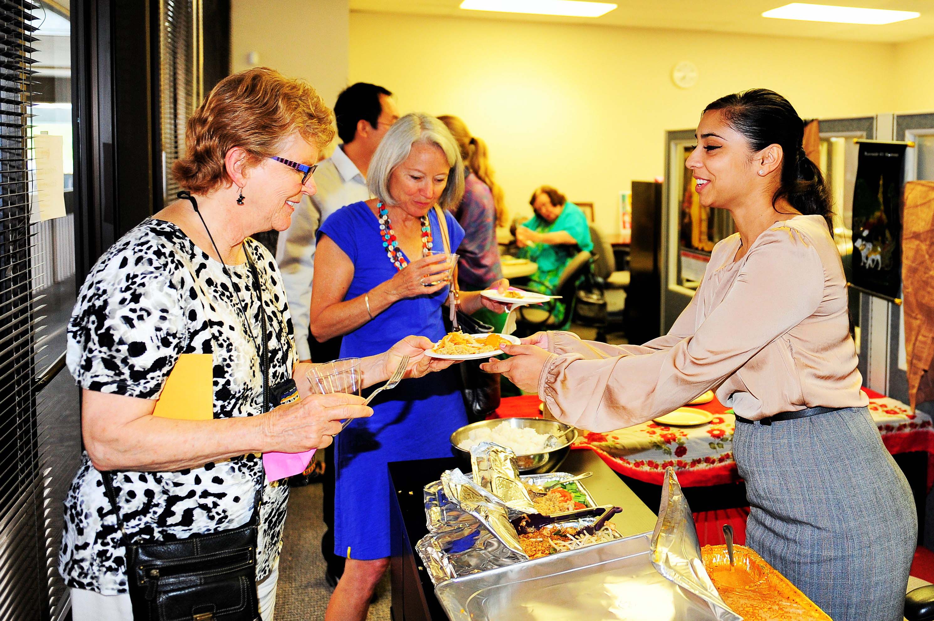 Volunteers serve tapas